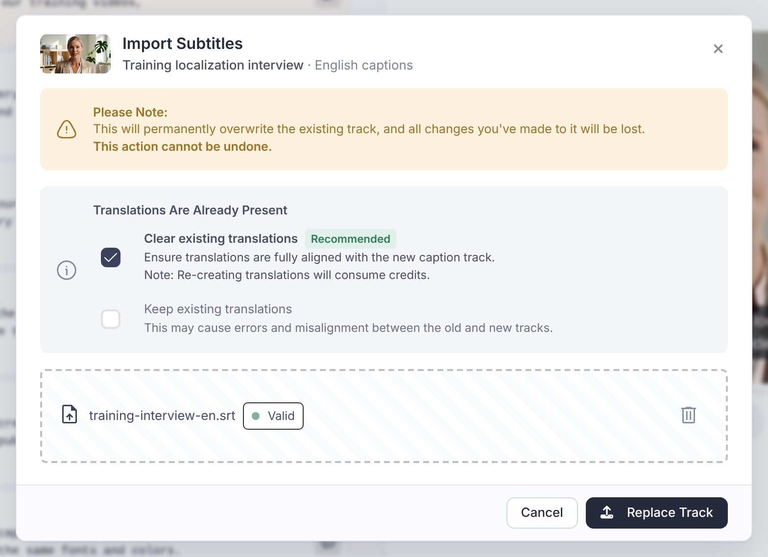 The Import Subtitles dialog with an .srt file chosen and validated, the note that the existing track will be overwritten, the Translations Are Already Present box with Clear existing translations marked Recommended, and the Replace Track button