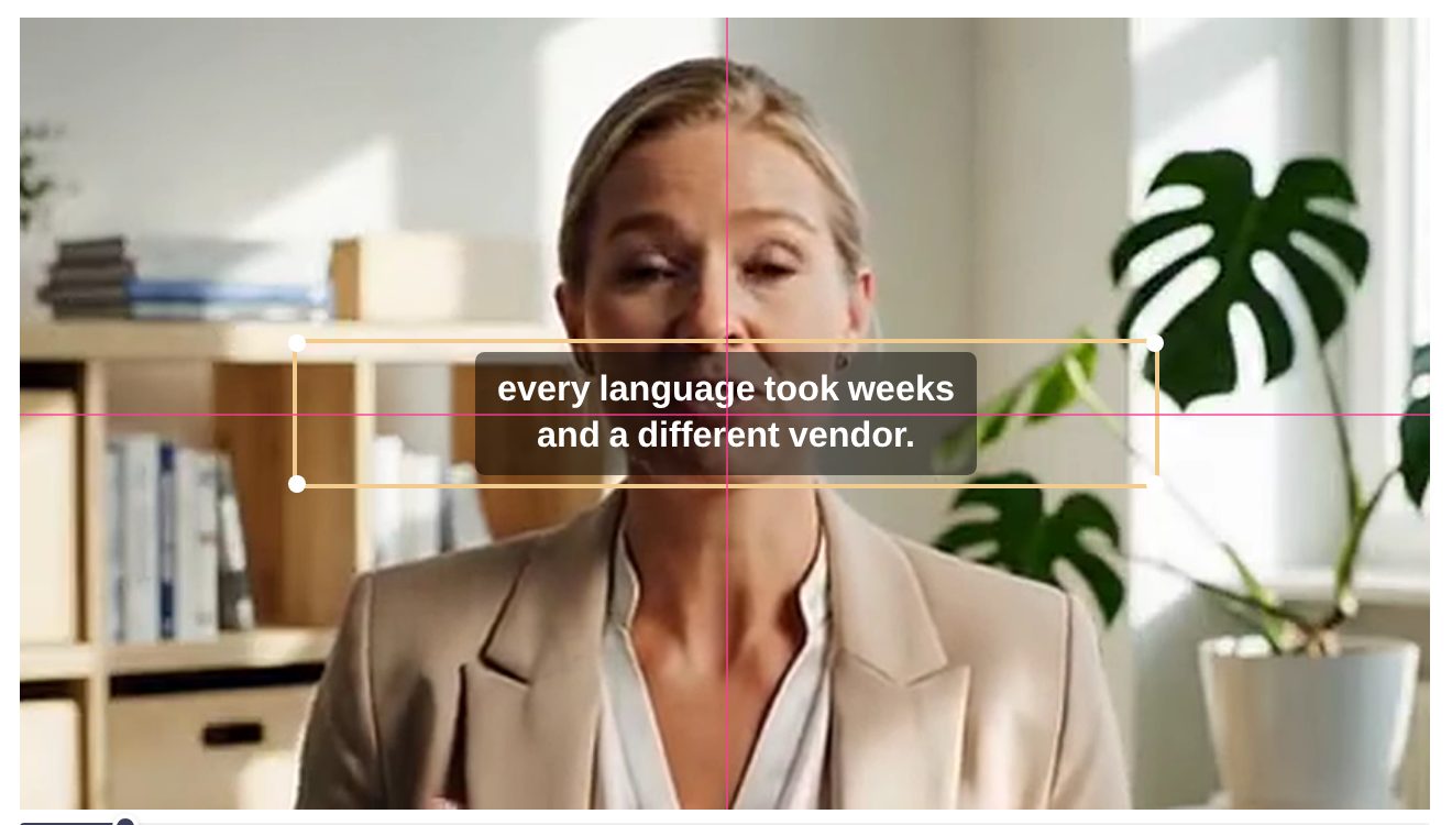 A subtitle being dragged on the video, with the pink snap guides marking the centre